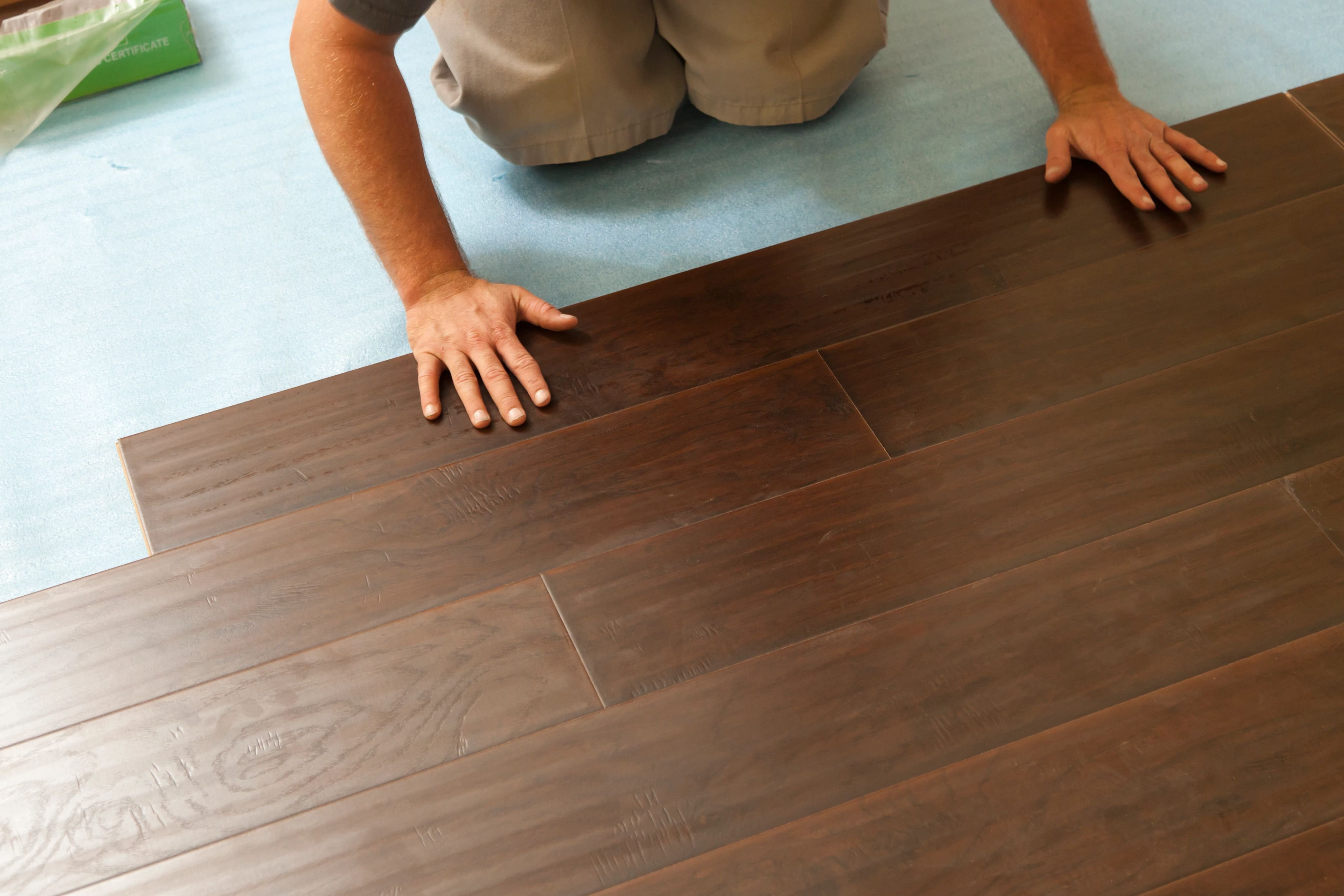 Person installing flooring - Professional flooring installation from Carpet & Flooring By Denny Lee in Abingdon, MD